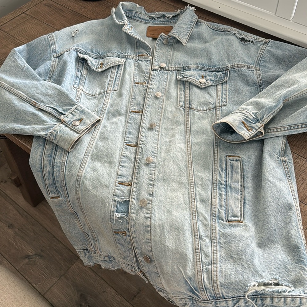 Oversized, distressed denim jacket